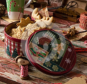 Gingerbread cookies in vintage gift round metal box with christmas ornaments