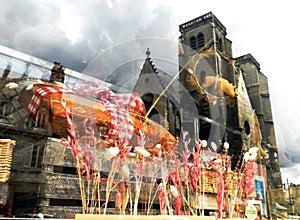Gingerbread of Dijon with a reflection of a church on the background, France photo