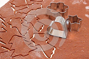 Gingerbread dough for Christmas cookies and cookie cutters