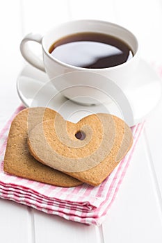 Gingerbread heart shape and coffee mug.