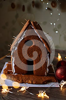 Gingerbread house cookies new year christmas, homemade baking house with garlands and toys