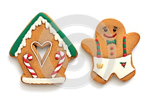 Gingerbread house and man on a white background. Christmas baking, top view, flat lay