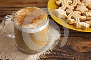 Gingerbread Latte in a Clear Mug with Cookies on the Side