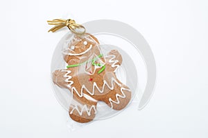 Gingerbread man cookie in a gift bag  on white