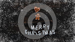 Gingerbread man cookie with Merry Christmas text flat lay