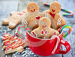 Gingerbread man cookies in red cup, Christmas holiday baking background