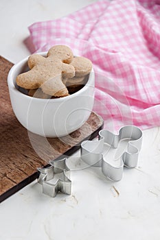 Gingerbread men cookies in a bowl.