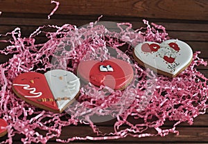 Gingerbread in the shape of a heart with a pink background, in a gift box.. Mom`s day. Valentine`s day.