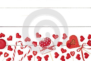 Gingerbread in shape of red heart and envelope for writing on white wooden background Happy Valentine`s day
