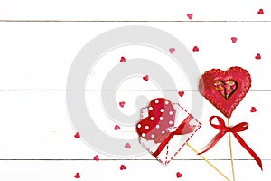 Gingerbread in shape of red heart and envelope for writing on white wooden background Happy Valentine`s day