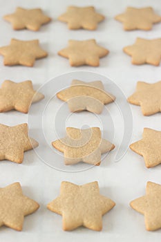 Gingerbread star cookie for Christmas on white background.