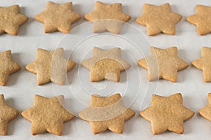 Gingerbread star cookie for Christmas on white background.