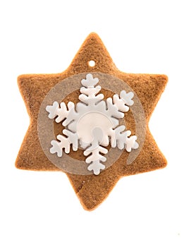 Gingerbread star shaped cookie with icing snowflake