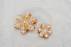 gingerbread star with sugar, spices, and vintage rolling pin on rustic, on textile linen background.