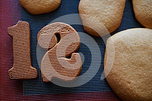 Gingerbread still life. Number 12 made from gingerbread dough. Handmade confectioner