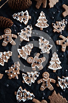 Gingerbread with white icing on a dark background