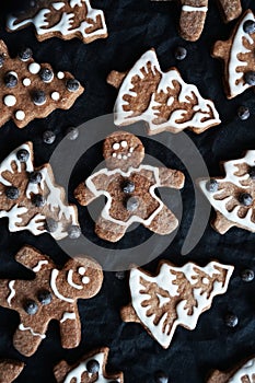 Gingerbread with white icing on a dark background