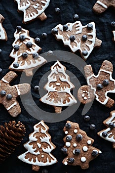 Gingerbread with white icing on a dark background