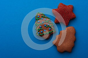 GingerbreadDelicious gingerbread cookies for christmas on blue background