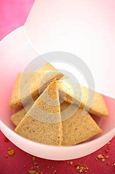 Gingerbreads in white plastic bowl