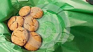Gingersnaps in green tissue photo