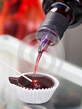 Ginja de Obidos, traditional sour cherry liquor, served in small photo