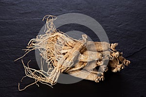 Ginseng on black ceramic background