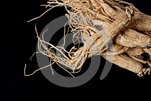 Ginseng on black ceramic background