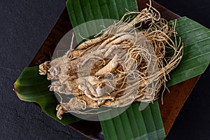 Ginseng on black ceramic background