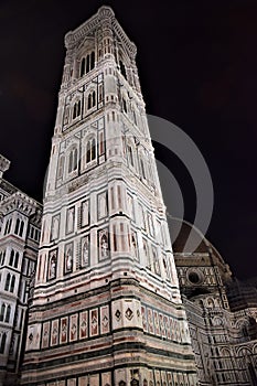 Giotto`s bell tower, illuminated on a November evening, in Florence.