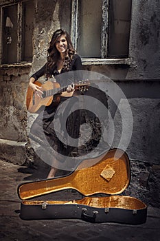 Gipsy girl playing guitar