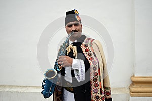 Gipsy singing traditional Romanian carols at saxophone.