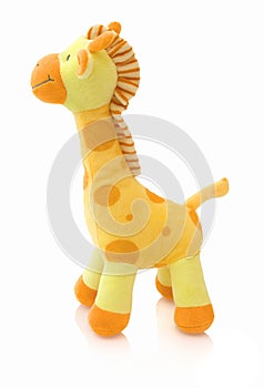 Giraffe plushie doll isolated on white background with shadow reflection. Giraffe plush stuffed puppet on white backdrop.