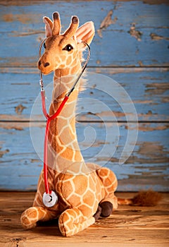 Giraffe toy with stethoscope from the side