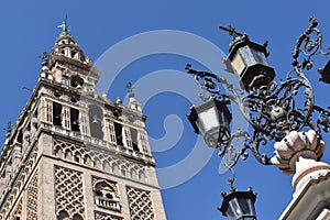 Giralda bell tower and antique lamppost in Seville