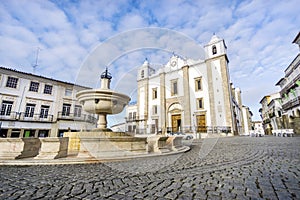 Giraldo Square with fountain and Saint Anton`s church, Evora, Al