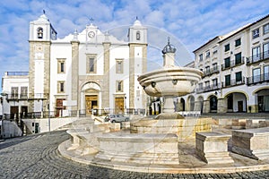 Giraldo Square with fountain and Saint Anton`s church, Evora, Al