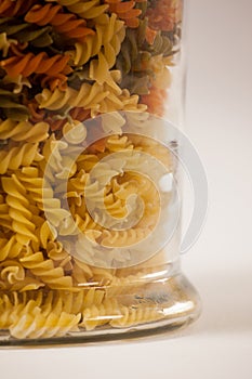 Girandole pasta in a glass container