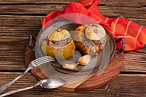 Giraumon or turbaned pumpkin stuffed with meat in an old dish photo