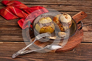 Giraumon or turbaned pumpkin stuffed with meat in an old dish photo