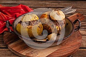 Giraumon or turbaned pumpkin stuffed with meat in an old dish photo