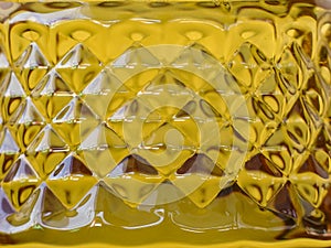 Gird pattern shape surface of golden oil bottle background