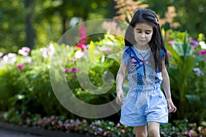 Girl 3-4 years walking in the Park outdoors