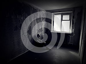 Girl in an abandoned creepy room photo