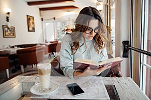 Girl absorbed in reading book