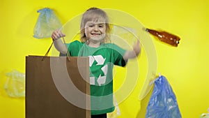 Girl activist with cellophane and paper packages. Reduce plastic pollution. Save ecology environment