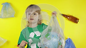 Girl activist with Earth globe in plastic package. Reduce trash pollution. Save ecology environment