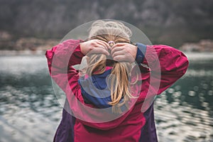 Girl adjusting her hair