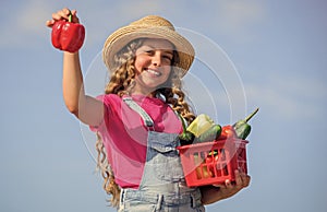 Girl adorable child farming. Homegrown veggies. Natural vitamin nutrition. Crops harvest. Harvest season. Child carry