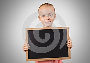 Girl against grey background with blackboard